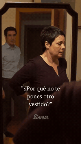 Animated GIF from a Liven ad: a woman standing at a mirror in a hallway with a man visible behind her, with the Spanish caption Why don't you put on a different dress?